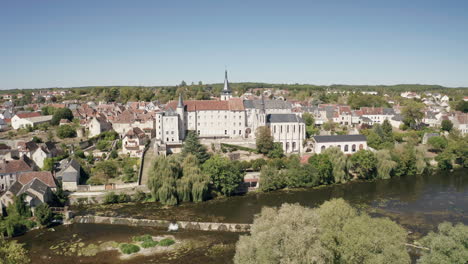 Aerial-drone-point-of-view-of-the-town-of-Saint-Gaultier-on-the-banks-of-the-river-Creuse-in-Indre,-France