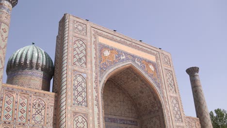 ornate fascade of madrassa and mosques with detailed tiling in samarkand, uzbekistan along the historic silk road