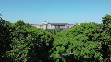 amazing view from a park full of trees to the neoclassical architecture of the law school in buenos aires