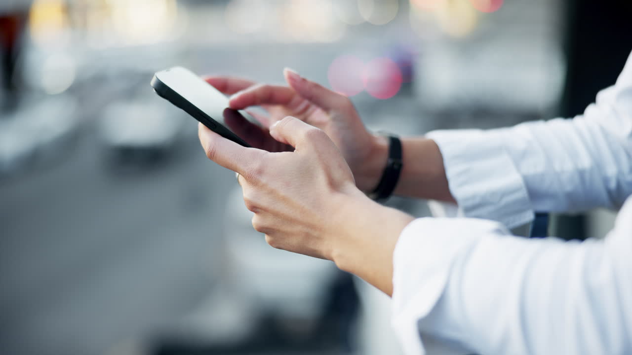 Person using a smartphone in an urban setting
