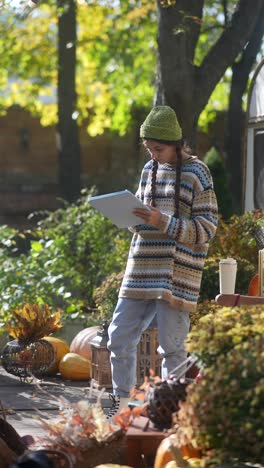 teenager studying outdoors in autumn setting