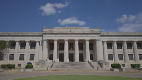 Low-angle-shot-of-white-house-with-moving-backward