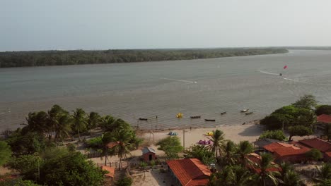 Aerial:-Kitesurfing-in-the-river-delta-of-Parnaiba,-Northern-Brazil