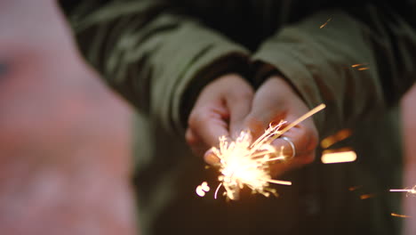 person holding sparkler