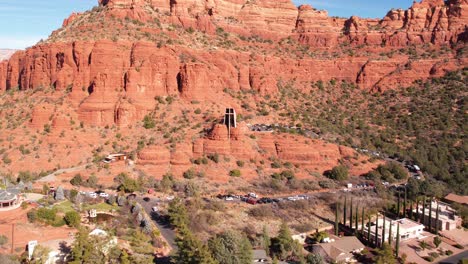 aerial view, chapel of holy cross under red sandstone hills and cliffs of sedona, arizona usa