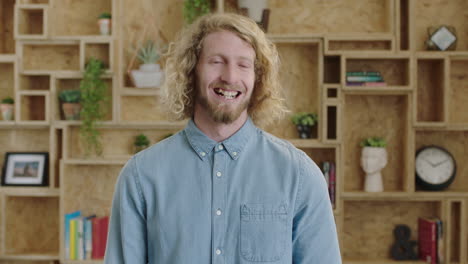 portrait of charming geeky hipster man smiling cheerful optimistic young businessman