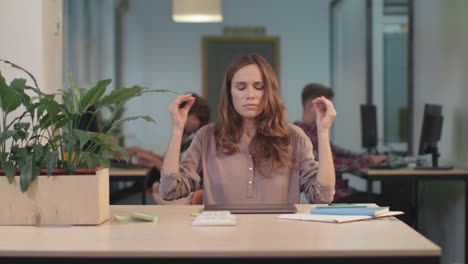 business woman reading bad news at coworking. tired woman breathing deep.