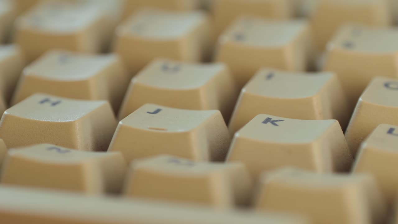 Man working and gaming on retro computer PC, IT engineer with vintage computer at home, using old fashion technology, close up of retro setup.