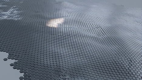 abstract hexagonal wavy surface with light reflection