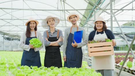 happy farmers in a greenhouse