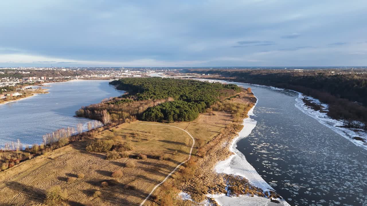 Icy river and frozen lake near Kaunas city, aerial view