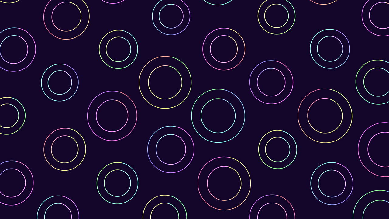 círculos de colores en un patrón sobre un fondo oscuro