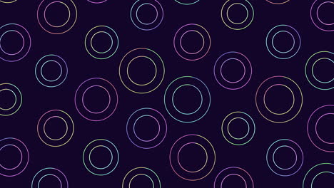 Colorful circles in a pattern on dark background