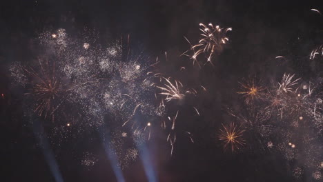 exploding fireworks and bright colors in the night sky