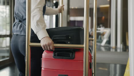 hotel porter pushing luggage