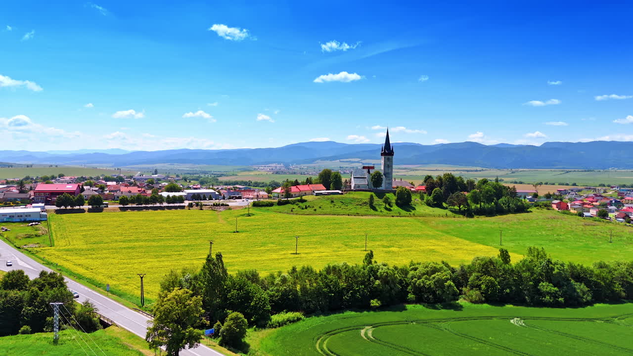 Picturesque countryside with a beautiful village. Vast scenery of Slovakia nature and Tatra mountains. Aerial view