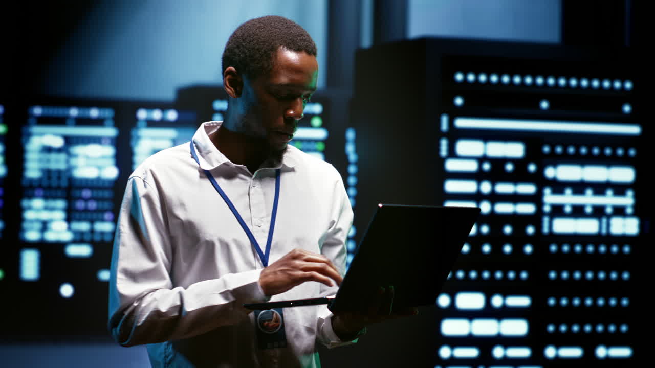 Admin using laptop to audit servers