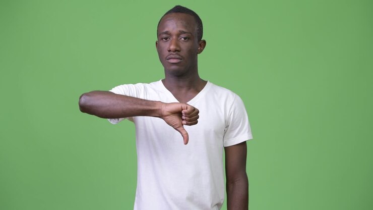 Young African man giving thumbs down