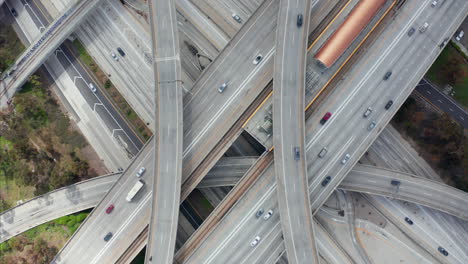 AERIAL:-Spectacular-Overhead-Shot-of-Judge-Pregerson-Interchange-showing-multiple-Roads,-Bridges,-Highway-with-little-car-traffic-in-Los-Angeles,-California-on-Beautiful-Sunny-Day