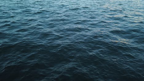 Scenic-View-Of-A-Wavy-Seascape-During-Sundown-In-Summer