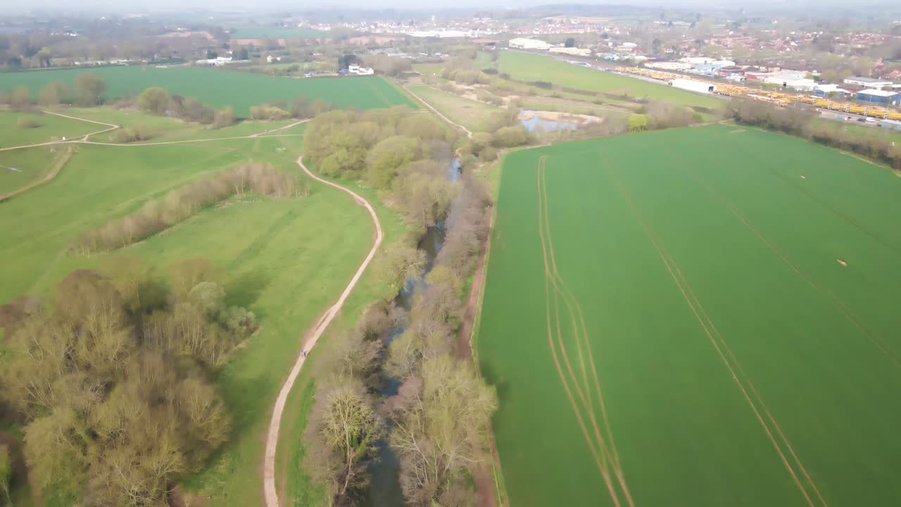 4K flying over the river tone near french weir park in taunton somerset, camera raising to reveal the sky. 600fps