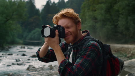 young photographer using photo camera