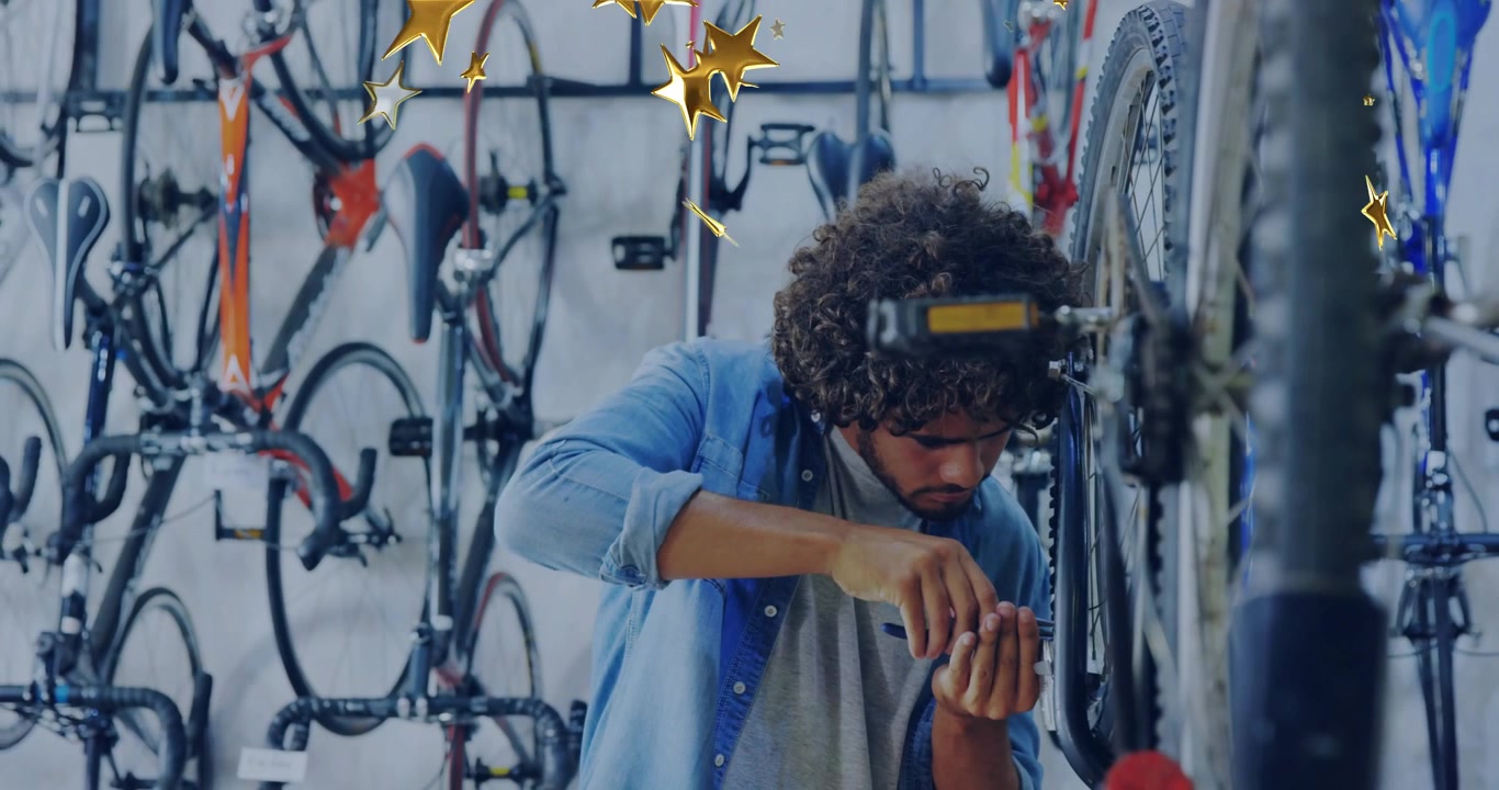 Spotting wheel wobble, bicycle mechanic tightening nut on stand in workshop, ensuring smooth spin