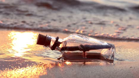 message in the bottle against the sun setting down