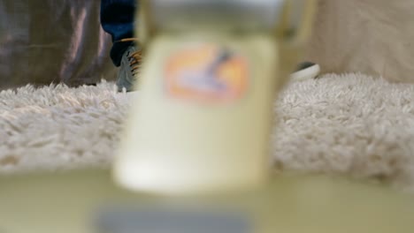 man cleaning a carpet with a vacuum cleaner