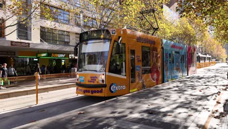 tram with vibrant advertisements in melbourne