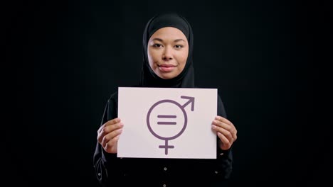 arab woman in hijab showing gender equality symbol smiling, stop discrimination