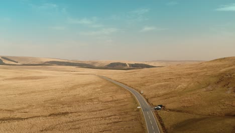 Aerial-view-of-beautiful-mountain-road,-Wales,-UK