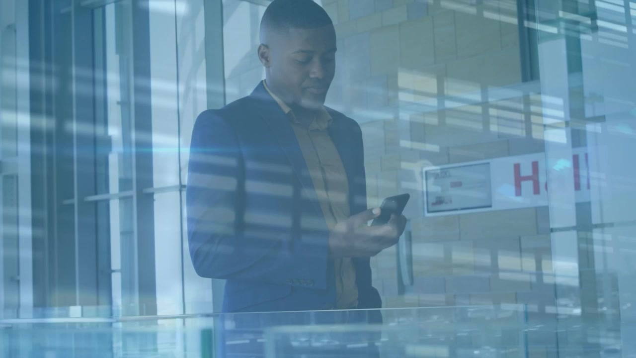 Animation of data processing over african american businessman using smartphone
