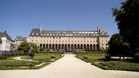 grand building with beautiful gardens