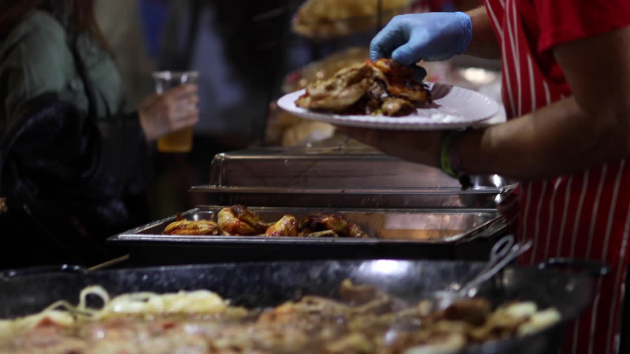 Man preparing and serving street food