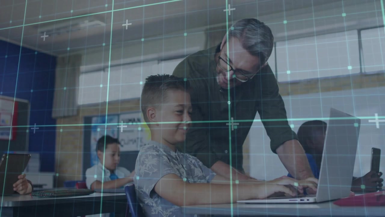 Teacher leaning over pupil's laptop, guiding typing while grid highlighting keys for classroom