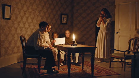 family reading a letter