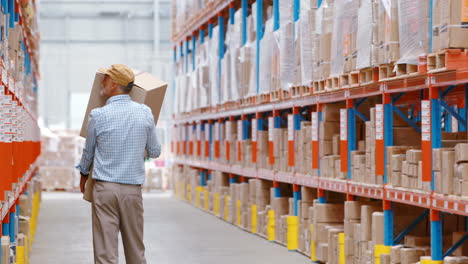 warehouse worker holding packages