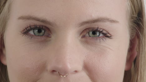 close-up-face-beautiful-blonde-woman-eyes-blinking-staring-at-camera-wearing-nose-ring