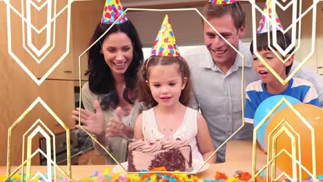 Animation-of-gold-pattern-over-happy-family-at-birthday-party