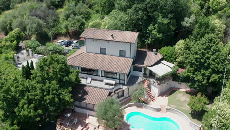 high jib down of small mediterranean villa with pool