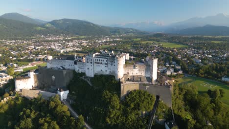 Aerial-Pullback-Reveals-Hohensalzburg-Fortress--at-Sunset.-Salzburg
