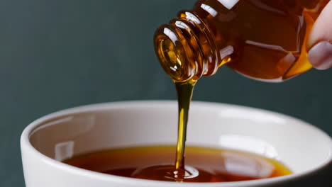 pouring oil into a bowl