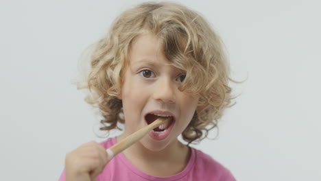 small girl brushing her teeth