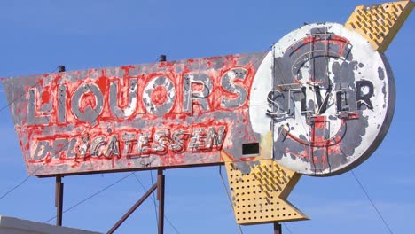 close up of an abandoned liquor store sits in a modern ghost town near boron california