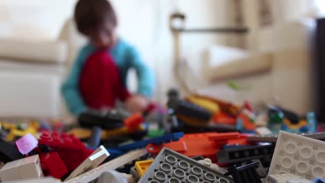 child playing colorful toys