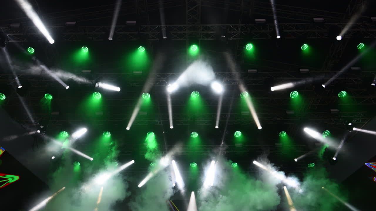 Dynamic light show highlights vibrant stage setup for outdoor concert