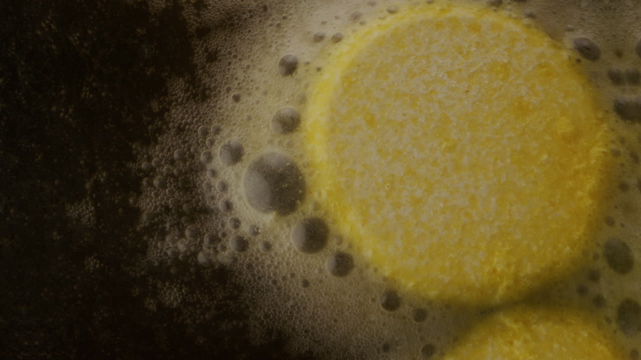 Yellow Food Items Boiling in Water
