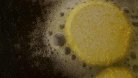 yellow food items boiling in water