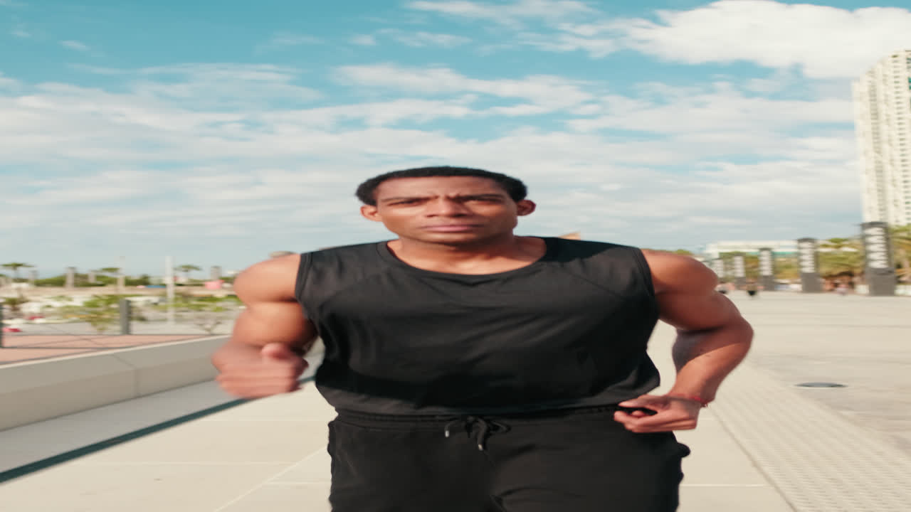 Determined Male Athlete Runs Through City